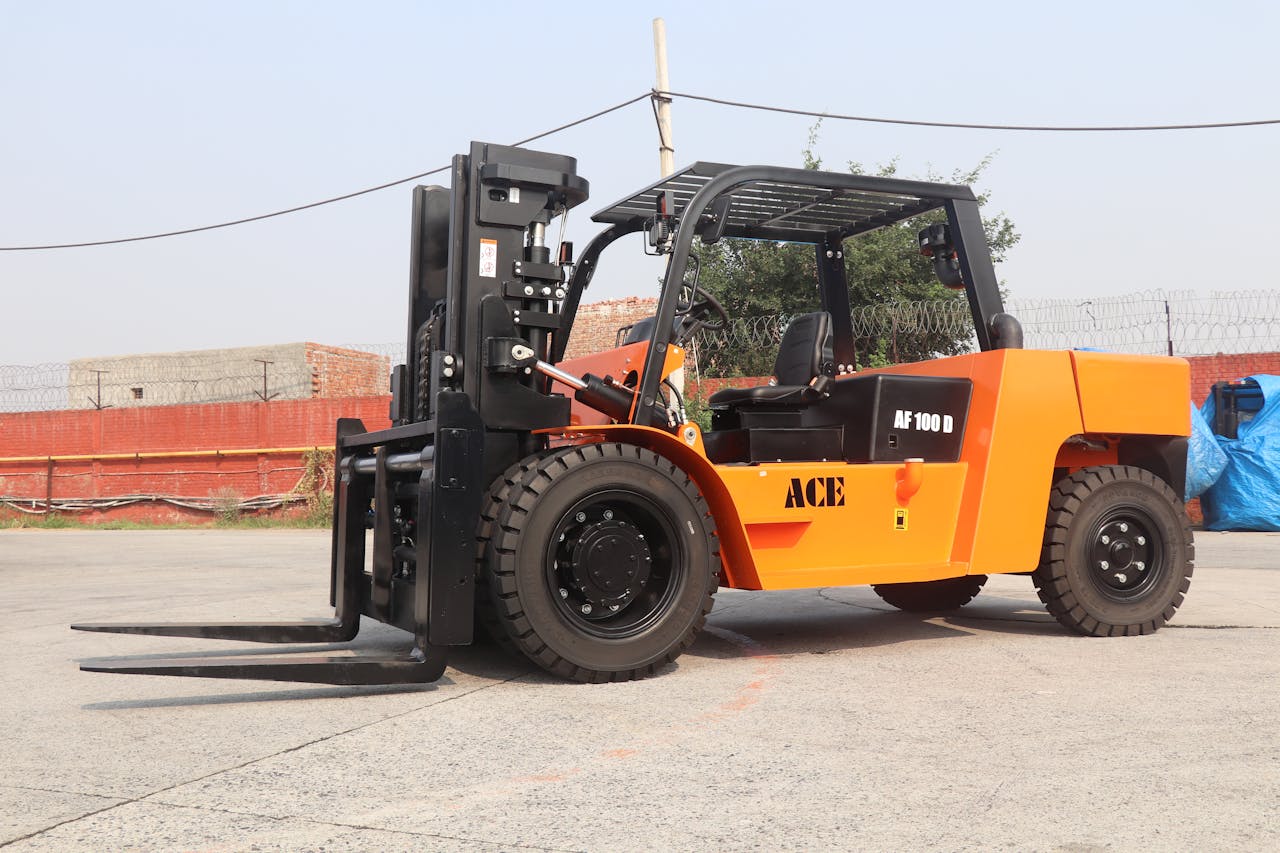 Image of an ACE AF 100D forklift in an outdoor industrial area in India.
